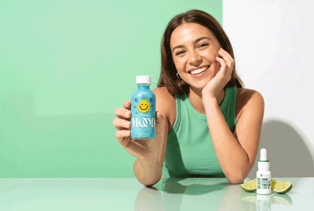 a woman holding a bottle of juice