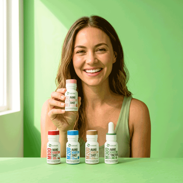 a woman holding a bottle of vitamins