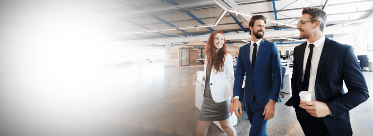 a man and woman walking in an office