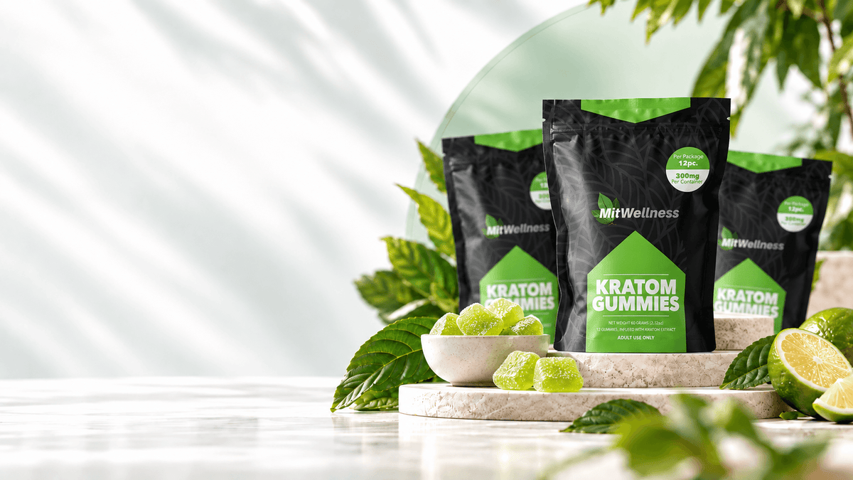 a group of black bags with green gummy candies in front of green leaves