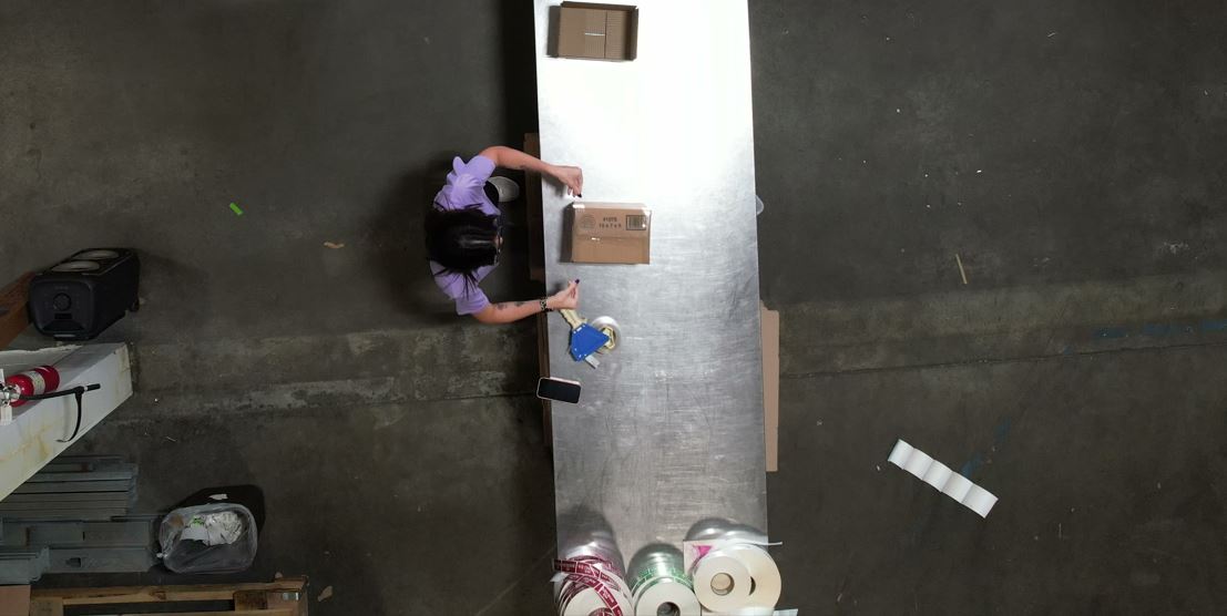 a woman standing at a counter